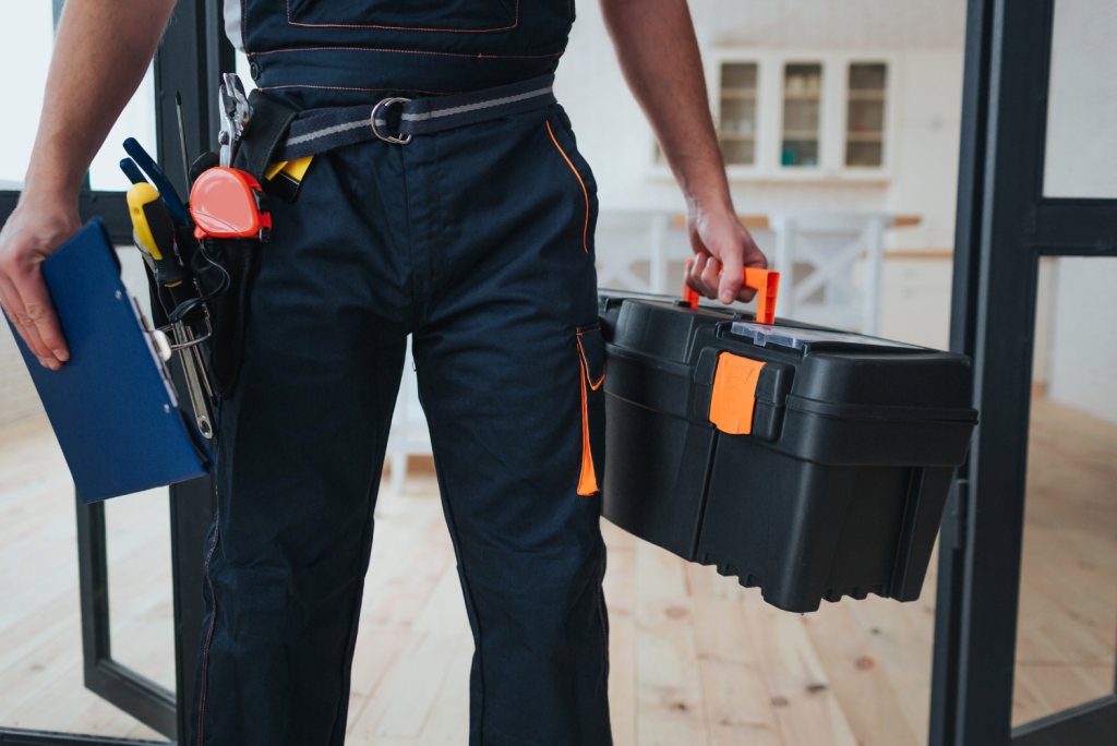 Home Repair Services - a handyman with a tool belt and tool box